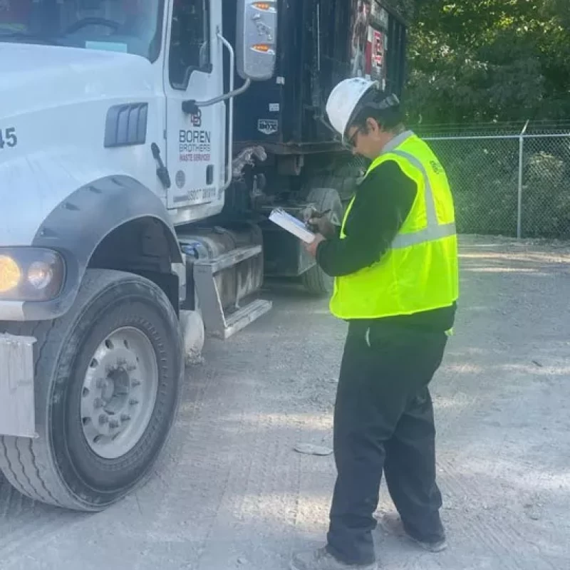 Man inspecting truck